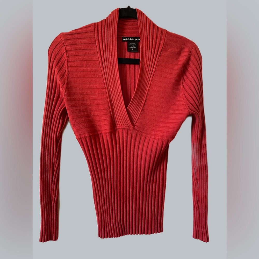 Festive, pumpkin colored, long sleeve sweater by United States Sweaters.